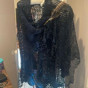 Handmade all leather.  The pin is also down by an artist.